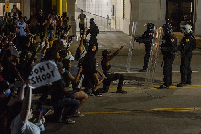 (Trent Nelson  |  The Salt Lake Tribune) Protesters stand off with police while marching through Salt Lake City on Monday, June 1, 2020.
