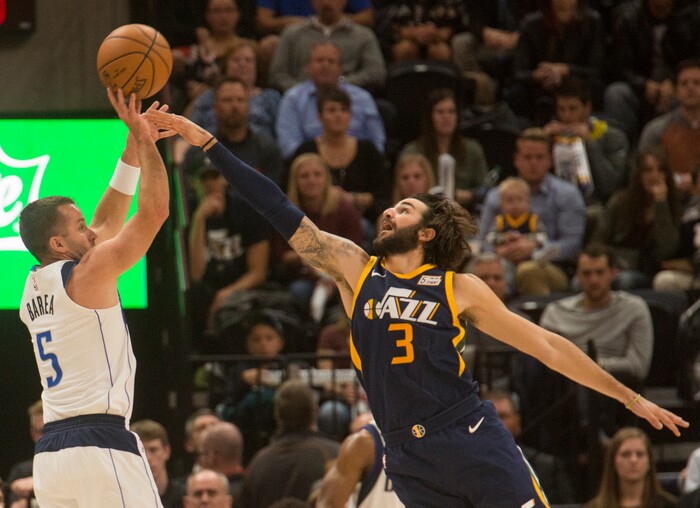 (Rick Egan  |  The Salt Lake Tribune)  Dallas Mavericks guard J.J. Barea (5) takes a shot, as Utah Jazz guard Ricky Rubio (3) defends, in NBA action Utah Jazz vs. Dallas Mavericks, in Salt Lake City, Monday, October 30, 2017.