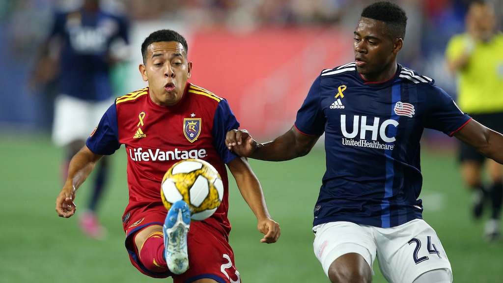 Real Salt Lake midfielder Sebastian Saucedo (23) controls the ball as New England Revolution midfielder DeJuan Jones (24) defends during the first half of an MLS soccer match at Gillette Stadium, Saturday, Sept. 21, 2019, in Foxborough, Mass. (AP Photo/Stew Milne)