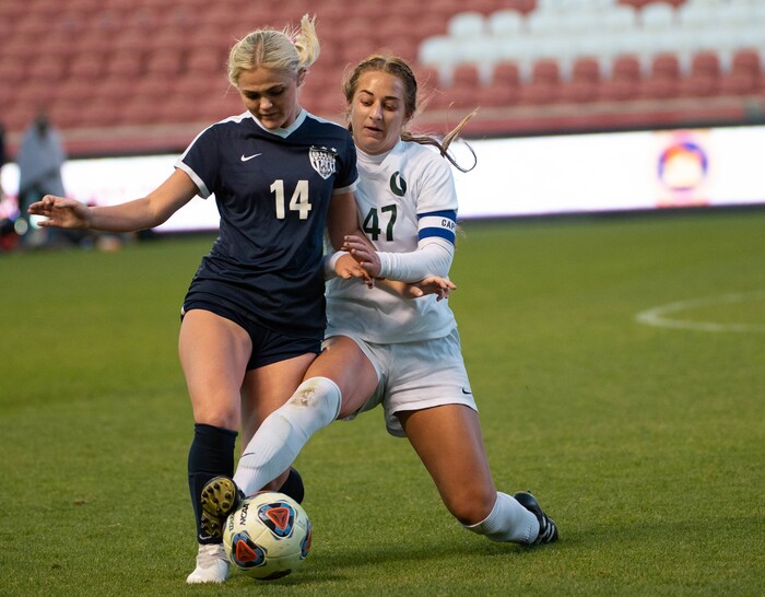 (Francisco Kjolseth  |  The Salt Lake Tribune) Madeline Callahan #14 of Bonneville battles Sofia Ward #47 of Olympus as they compete in their 5A high school girls championship game at Rio Tinto Stadium in Sandy on Friday, Oct. 23, 2020. Bonneville went on to win 1-0 in overtime.