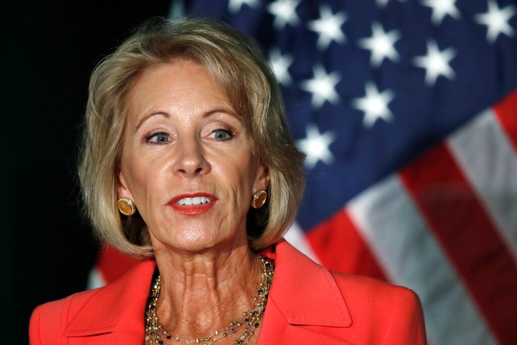 (AP Photo/Jacquelyn Martin, File) In this Sept. 7, 2017, file photo, Education Secretary Betsy DeVos speaks at George Mason University Arlington, Va., campus. Complaints and lawsuits lodged against for-profit colleges are unfolding as DeVos engineers a seismic shift in the regulatory landscape that stands to benefit the multibillion-dollar industry.