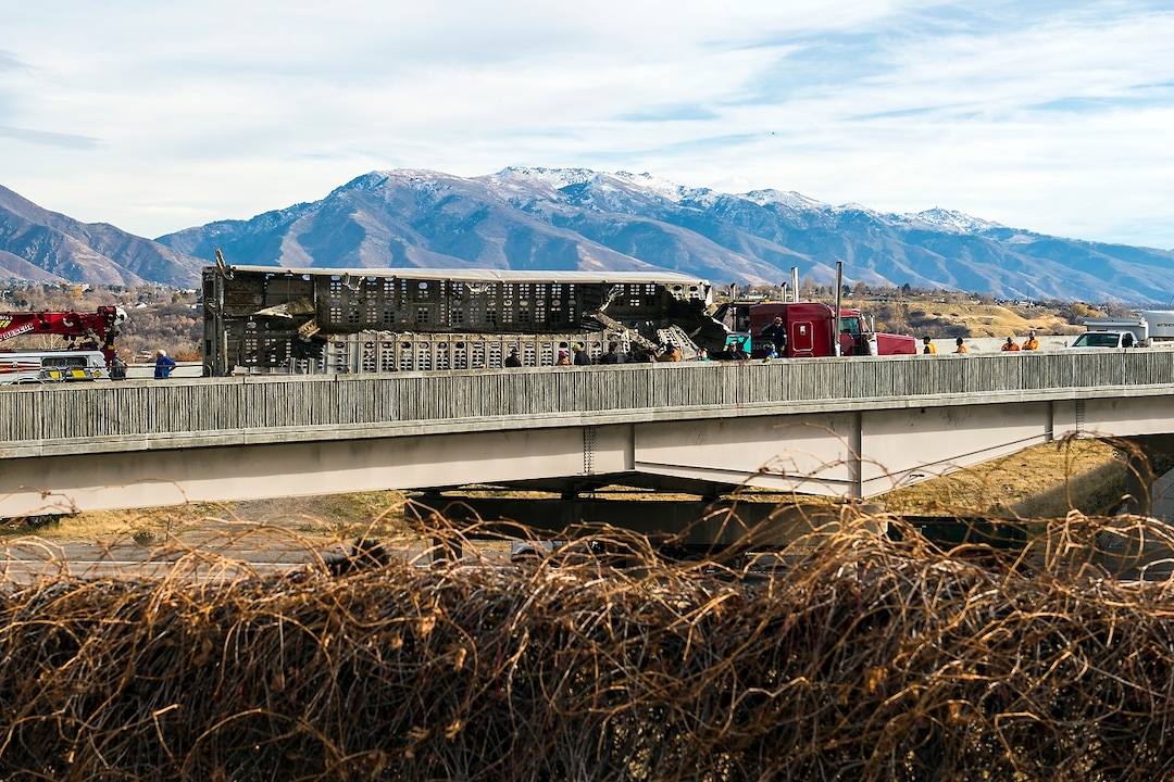 (Chris Detrick  |  The Salt Lake Tribune)  Emergency crews respond to a crashed semi truck hauling cattle on an Interstate 84 overpass in Riverdale Wednesday, November 22, 2017.  While taking the I-15 southbound ramp onto eastbound I-84 at 11:30 a.m., the weight in the semi truck shifted, and the truck tipped over, according to Utah Highway Patrol officials. The truck driver had been speeding, UHP said.