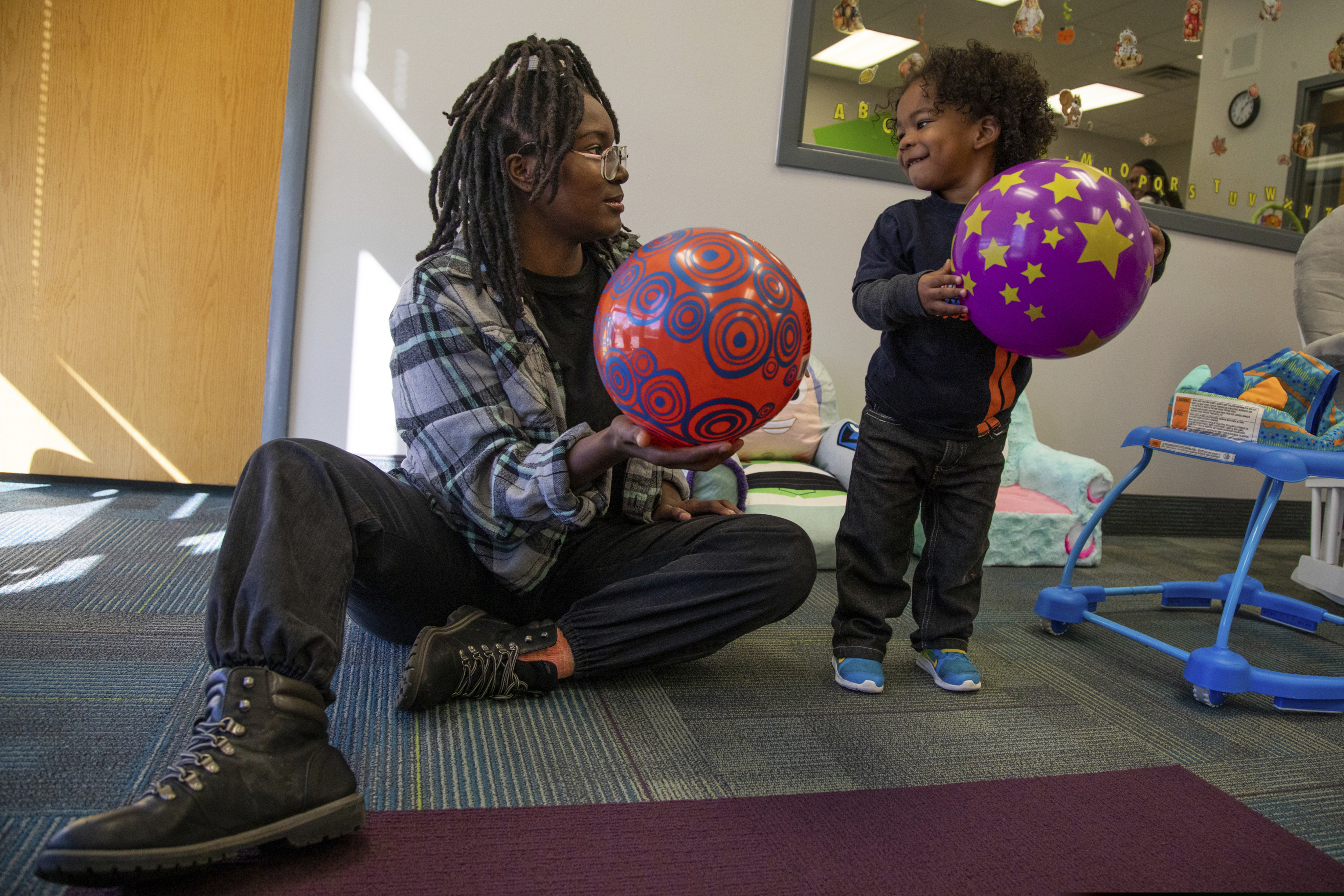 (Ben Dorger | Standard-Examiner via AP) In this Oct. 3, 2019, photo, Te' Adora Roach, 18, plays with her son Jay'Cinthyan, 2, in the new child care program at Two Rivers High School, in Ogden, Utah. A new child care program at a Utah high school helps several young mothers attend classes and spend more time with their children, the Standard Examiner reports.