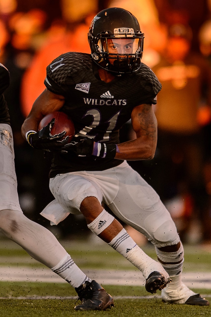 (Trent Nelson | The Salt Lake Tribune)  Weber State Wildcats running back David Jones (21) runs the ball as Weber State hosts Southern Utah, NCAA football in Ogden Saturday October 14, 2017.