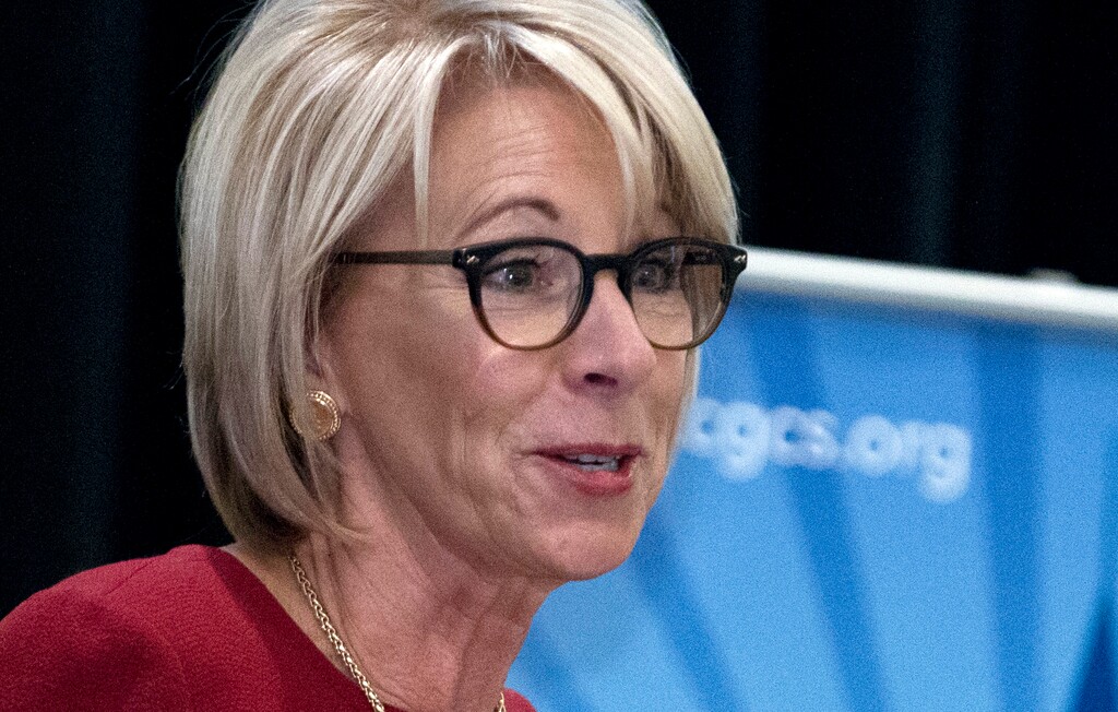 FILE - In this March 13, 2017, file photo, Education Secretary Betsy DeVos speaks at the Council of the Great City Schools Annual Legislative/Policy Conference in Washington. Government officials say additional security detail for DeVos may cost up to $7.8 million through September. The U.S. Marshals Service said in a statement April 7, that a threat to DeVos’ safety was identified in February and she was put under additional protection. The statement did not provide details on the threat. (AP Photo/Jose Luis Magana, File)