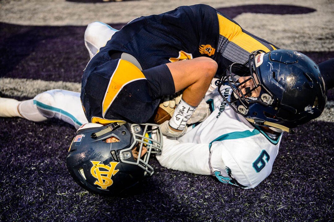 (Trent Nelson | The Salt Lake Tribune)  Summit Academy's Gavin Davey scores a touchdown as Juan Diego's Dawson Stiefel also grips the ball. Summit Academy faces Juan Diego High School in a class 3A state semifinal football game at Weber State University's Stewart Stadium, Saturday November 4, 2017.