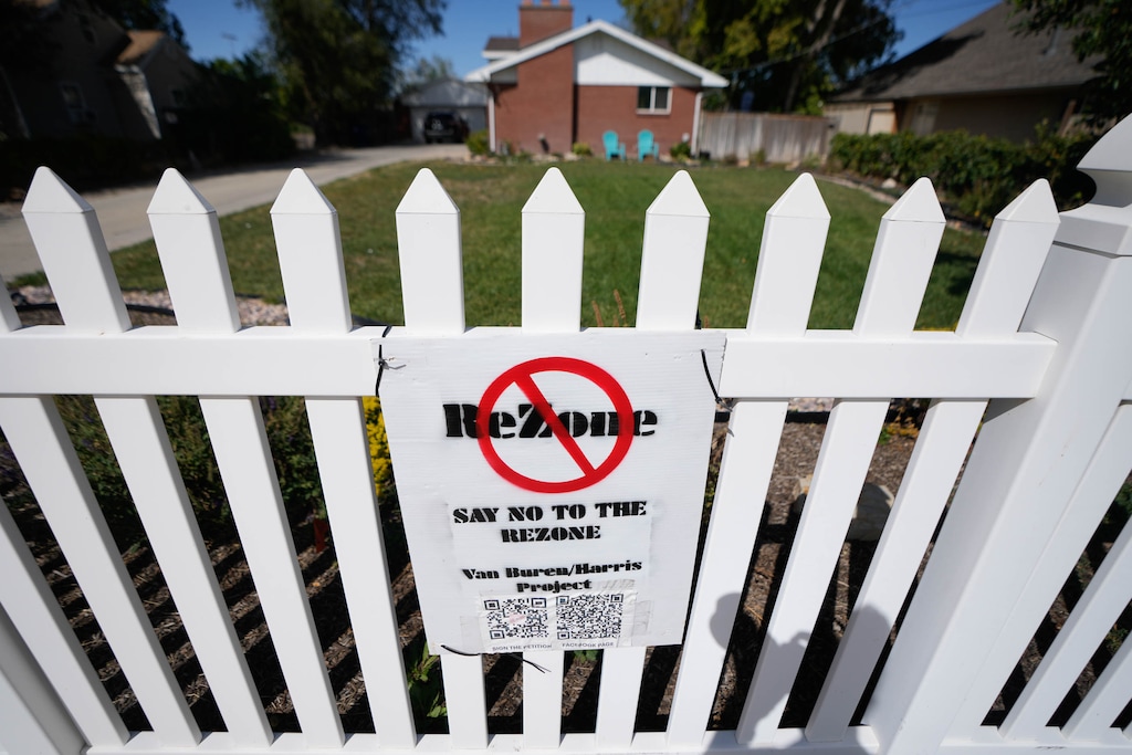 (Francisco Kjolseth | The Salt Lake Tribune) A sign opposes a rezone proposal that would allow more than 20 new housing units, including a number of affordable options, on three now-empty lots along a Glendale street otherwise zoned for single-family homes.