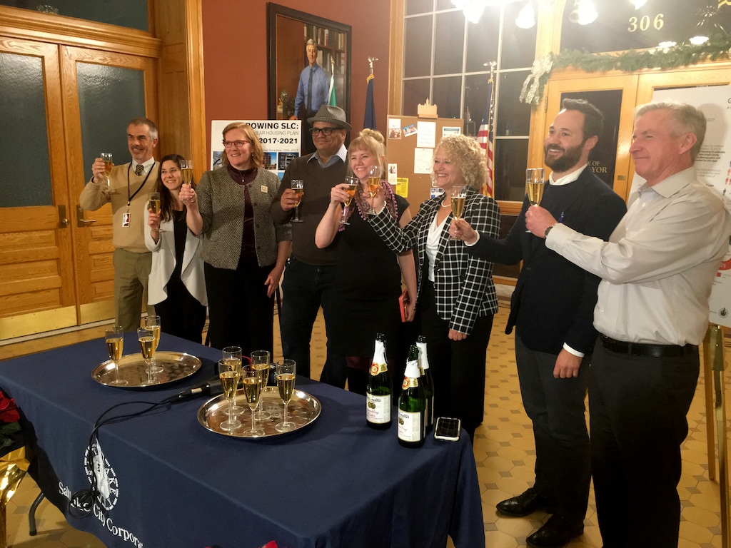 Salt Lake City Mayor Jackie Biskupski and other city officials raise a sparkling cider toast Tuesday night, Dec. 12, 2017, after the City Council approved a comprehensive city housing plan that will guide policy for the next five years.