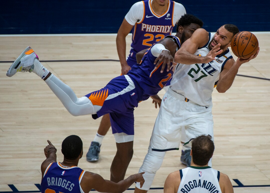(Rick Egan | The Salt Lake Tribune)Utah Jazz center Rudy Gobert (27) is fouled by Phoenix Suns center Deandre Ayton (22), in preseason NBA action between Utah Jazz and Phoenix Suns at Vivint SmartHome Area, on Saturday, Dec. 12, 2020.
