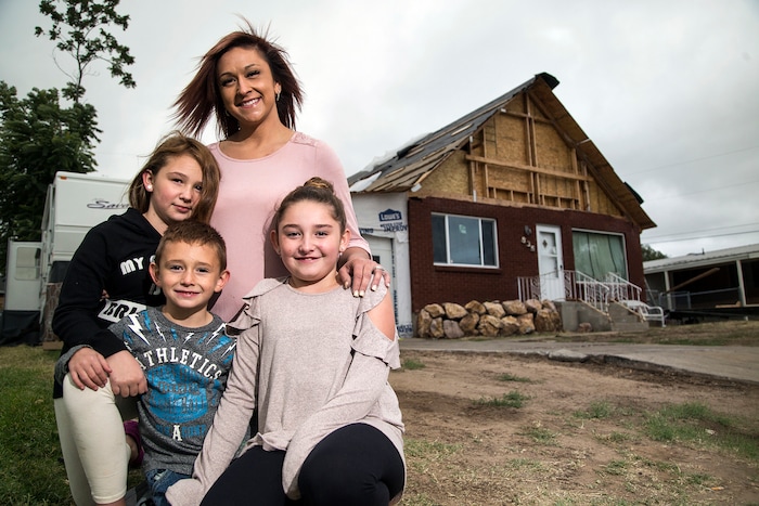 (Matt Herp |Standard-Examiner via AP) Krystal Elliot, center, poses for a portrait with her kids Brayden Elliot, 6, left, ShayLee Elliot, 8, and BrookLynn Elliot, 10, outside of their Riverdale, Utah home on Thursday, Sept. 21, 2017. The family is currently living in a trailer on their property as their home undergoes construction after being damaged by a tornado that hit parts of Weber Co. on Sept. 22, 2016.