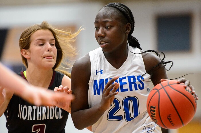 (Trent Nelson | The Salt Lake Tribune)  Bingham's Shanyce Makuei (20) drives on Northridge's Lauren Call (2) as Bingham faces Northridge in the 6A High School Girls' Basketball Tournament at SLCC in Taylorsville, Thursday Feb. 22, 2018.