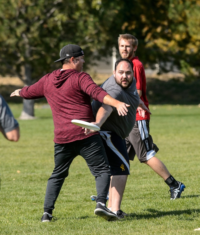 (Steve Griffin  |  The Salt Lake Tribune)  Xima Software employees play a game of Ultimate Frisbee during lunchtime on River Front Parkway in South Jordan Friday October 13, 2017.