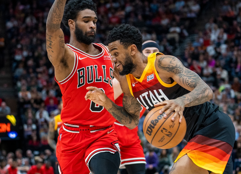 (Rick Egan | The Salt Lake Tribune) Utah Jazz guard Nickeil Alexander-Walker (6) takes the ball inside as Chicago Bulls guard Coby White (0) defends, in NBA action between the Utah Jazz and the Chicago Bulls, at Vivint Arena, on Wednesday, March 16, 2022.  