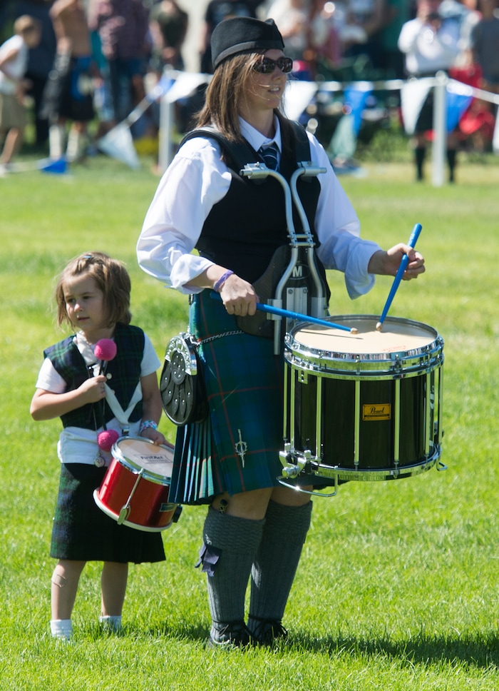 (Rick Egan  |  The Salt Lake Tribune)      Ane Larsen, 4, plays drums along with her mother Vanessa Larson from Highland, at the 44th annual Utah Scottish Festival and Highland Games at the Utah State Fairgrounds, Sunday, June 10, 2018.