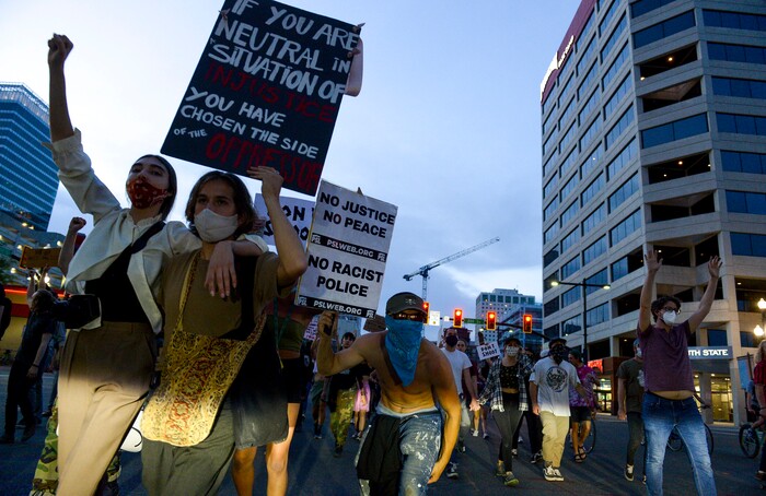 (Leah Hogsten  |  The Salt Lake Tribune) Protesters walk down State Street against police brutality in Salt Lake City on Monday, June 1, 2020.