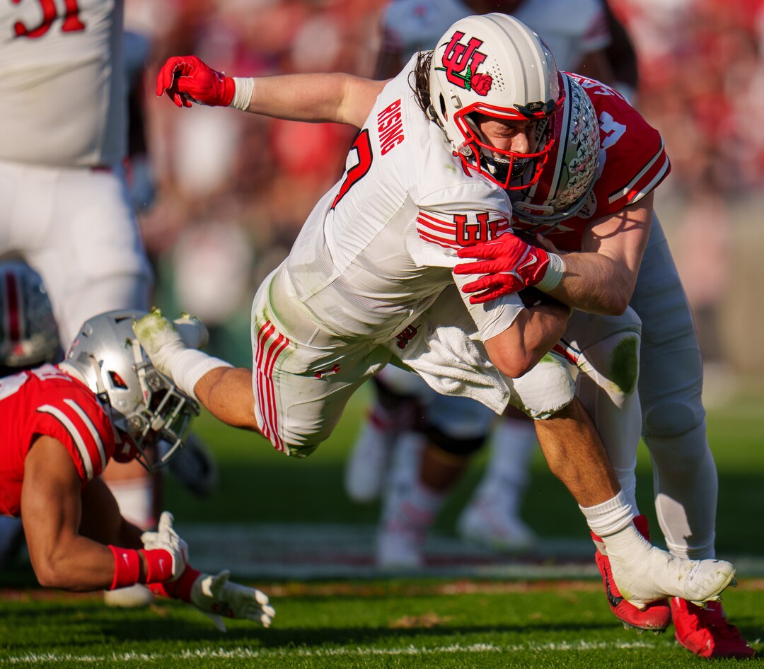 (Trent Nelson  |  The Salt Lake Tribune) Utah Utes quarterback Cameron Rising (7) is hit by Ohio State Buckeyes defensive end Jack Sawyer (33) as the Utah Utes face the Ohio State Buckeyes at the Rose Bowl in Pasadena, Calif., on Saturday, Jan. 1, 2022.