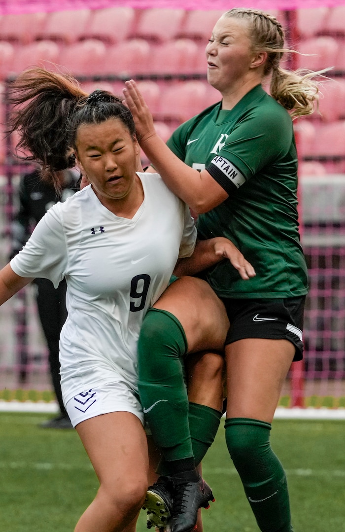 (Leah Hogsten | The Salt Lake Tribune)  RHSM's Grace Baranko and Camryn Kennedy, behind) collide with Waterford's Adeline Lin. Waterford School takes on Rowland Hall-St. Marks High School during their 2A State Soccer Championship game Oct. 23, 2021 at Rio Tinto Stadium.
