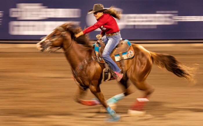(Rick Egan | The Salt Lake Tribune)  Stephanie Fryar, from Waco, Texas, competes in the barrel racing event at the Utah Days of '47 Rodeo at the State Fairpark, on Monday, July 25, 2022.