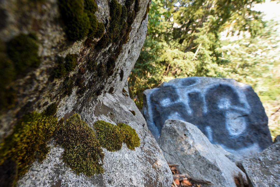 (Francisco Kjolseth  |  The Salt Lake Tribune)  Graffiti has proliferated in lower Little Cottonwood Canyon, where vandals, often wielding cans of fluorescent-colored spray paint, have covered granite faces, trees and structures. The vandalism is particularly apparent along the Temple Quarry Trail and the creek at the Moon Rock swimming hole and former pavilion site. Volunteers using donated equipment and solvents spend thousands of hours removing the paint from the rocks only to see graffiti return to the same faces or on rock nearby.