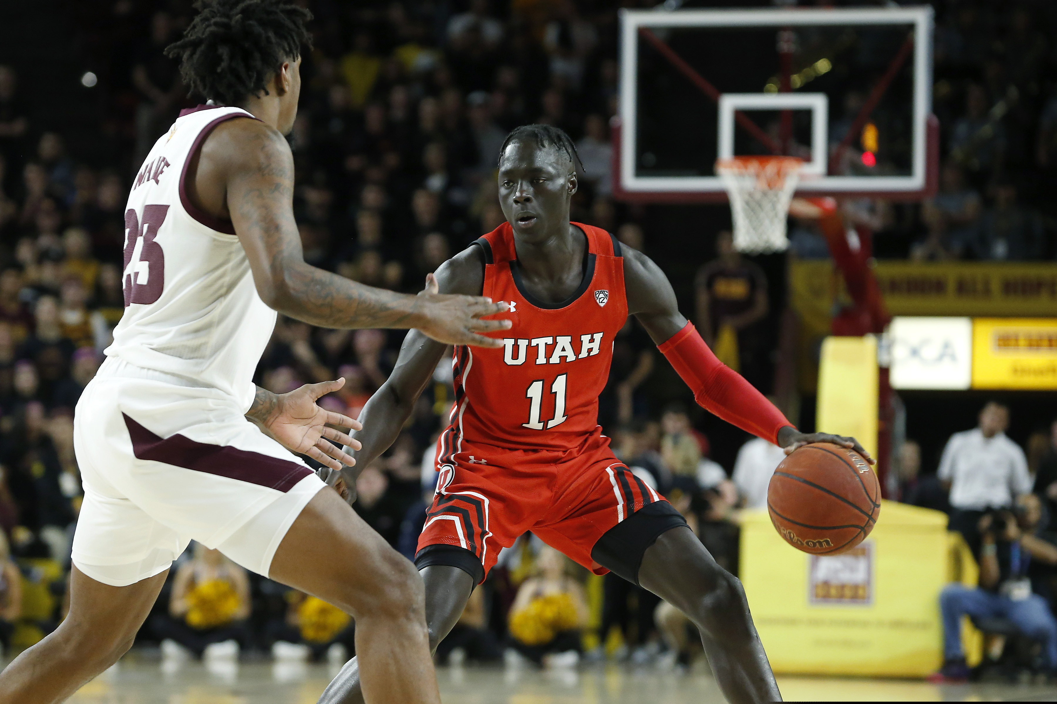 (Ralph Fres | AP file photo) Utah guard Both Gach (11) advances the ball up-court while Arizona State's Romello White (23) defends during the first half of an NCAA college basketball game in Tempe, Ariz., in this Saturday, Jan. 18, 2020, file photo. Gach switched schools to be closer to his family during the COVID-19 pandemic. Now at Minnesota, the junior guard has been granted immediate eligibility by the NCAA.