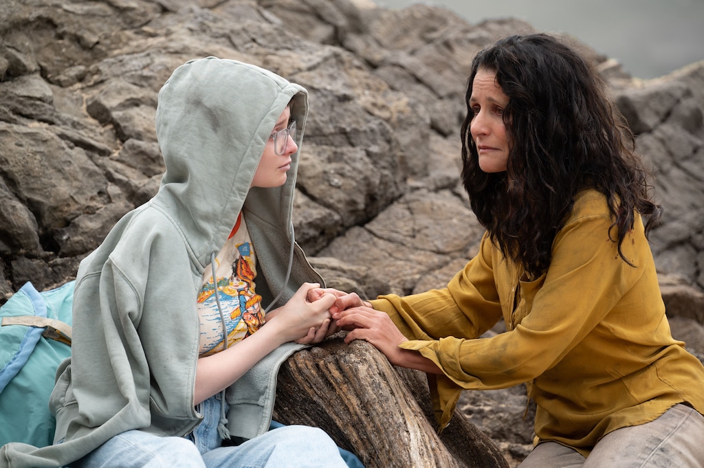 (A24) Zora (Julia Louis-Dreyfus, right) talks with her daughter, Tuesday (Lola Petticrew), about death — which appears in the form of a mangy parrot — in writer-director Daina O. Pusic's "Tuesday."