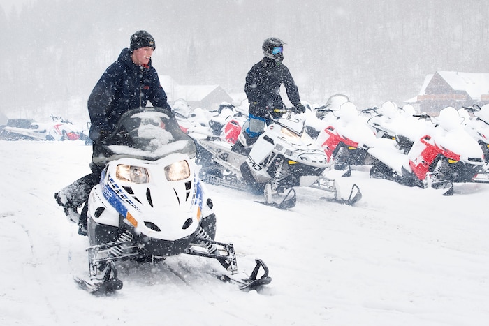 (Scott Sommerdorf   |  The Salt Lake Tribune)   
Snowmobiles are brought into position to be rented at Daniel Summit Saturday, December 23, 2017. While the number of snowmobile licenses in Utah is declining, trail usage is up dramatically.  