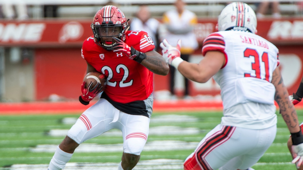 (Rick Egan  |  The Salt Lake Tribune)  Running back Devin Brumfield runs the ball as Keala Santiago defends on the play, in Utah's annual Read and White game at Rice-Eccles Stadium,Saturday, April 13, 2019.