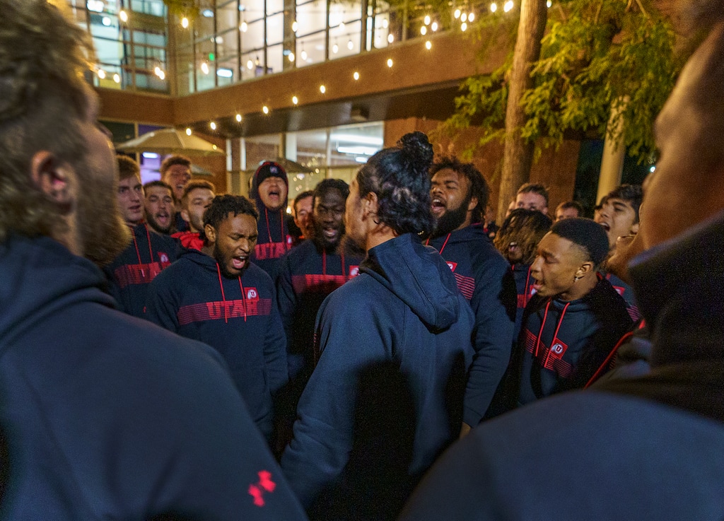 (Leah Hogsten | The Salt Lake Tribune)  The University of Utah football team mourns the loss of fellow student-athlete Aaron Lowe during a candlelight vigil at the A Ray Olpin Student Union southwest lawn, Sept. 29, 2021.