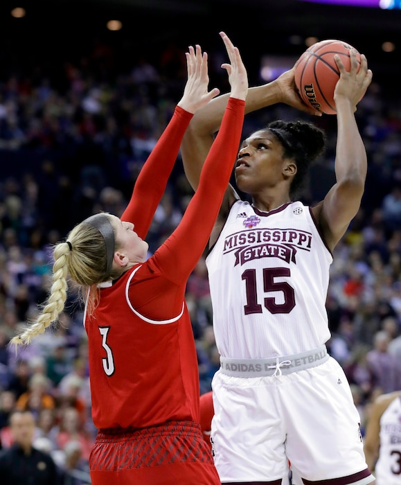 Mississippi State's Teaira McCowan (15) shoots over Louisville's Sam Fuehring (3) during the first half in the semifinals of the women's NCAA Final Four college basketball tournament, Friday, March 30, 2018, in Columbus, Ohio. (AP Photo/Ron Schwane)