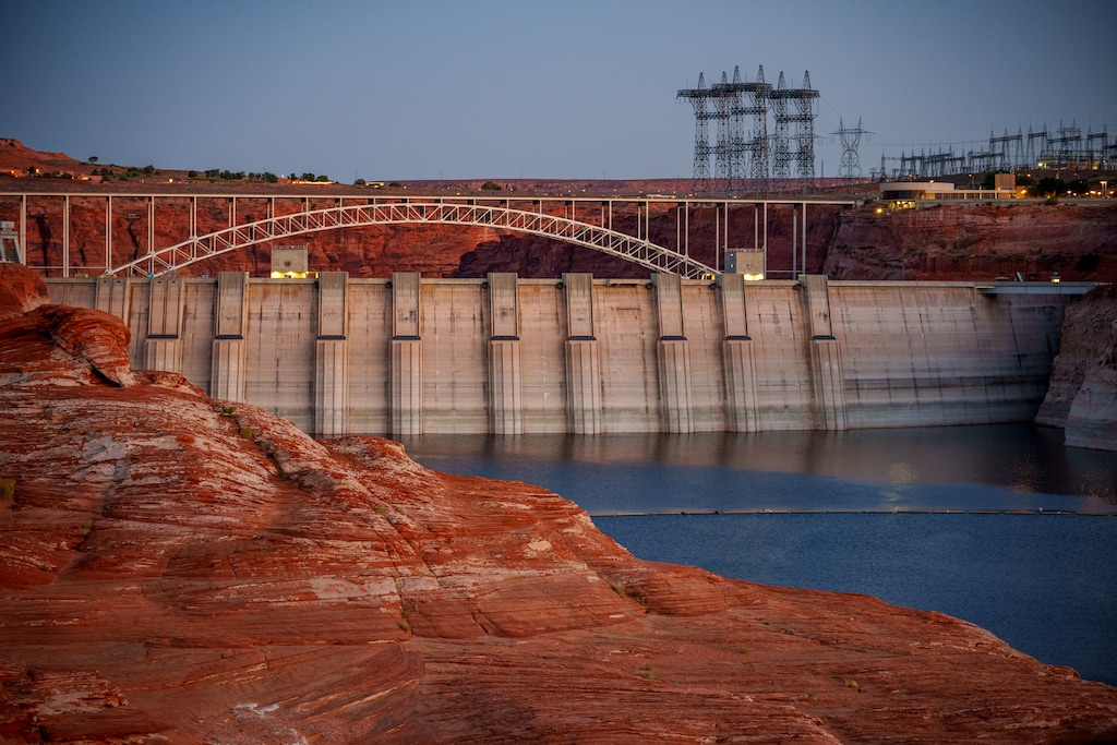 (Trent Nelson  |  The Salt Lake Tribune) Glen Canyon Dam and high-voltage transmission towers in Page, Ariz. on Tuesday, May 20, 2025.