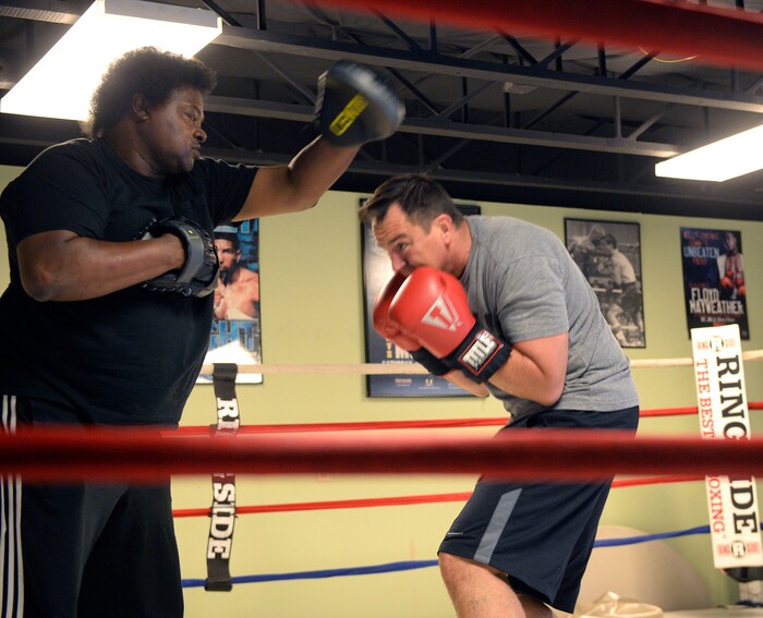 (Al Hartmann | The Salt Lake Tribune)
House Speaker Greg Hughes spars with Eddie "Flash" Newman during his workout at the Flash Academy gym in Holladay Tuesday August 29. He's among a handful of local politicians, police and lobbyists who will box in a series of charity matches to benefit a national group that works to end domestic violence.