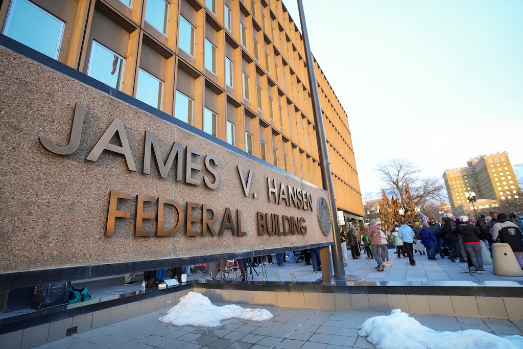 (Bethany Baker  |  The Salt Lake Tribune) Protesters gather during a rally to protest the layoffs of federal workers in front of the James V. Hansen Federal Building in Ogden on Wednesday, Feb. 19, 2025. The Department of Government Efficiency plans to lay off thousands of IRS employees, including workers at the Ogden office.