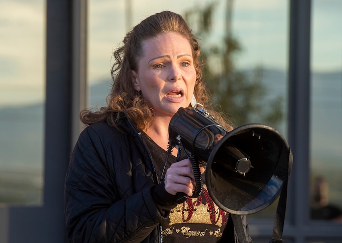 (Rick Egan  |  The Salt Lake Tribune)  Beth Thompson speaks at a rally for prison inmates, after a COVID-19 outbreak has spread at the Draper prison, at the Department of Corrections, on Tuesday, Oct. 13, 2020.