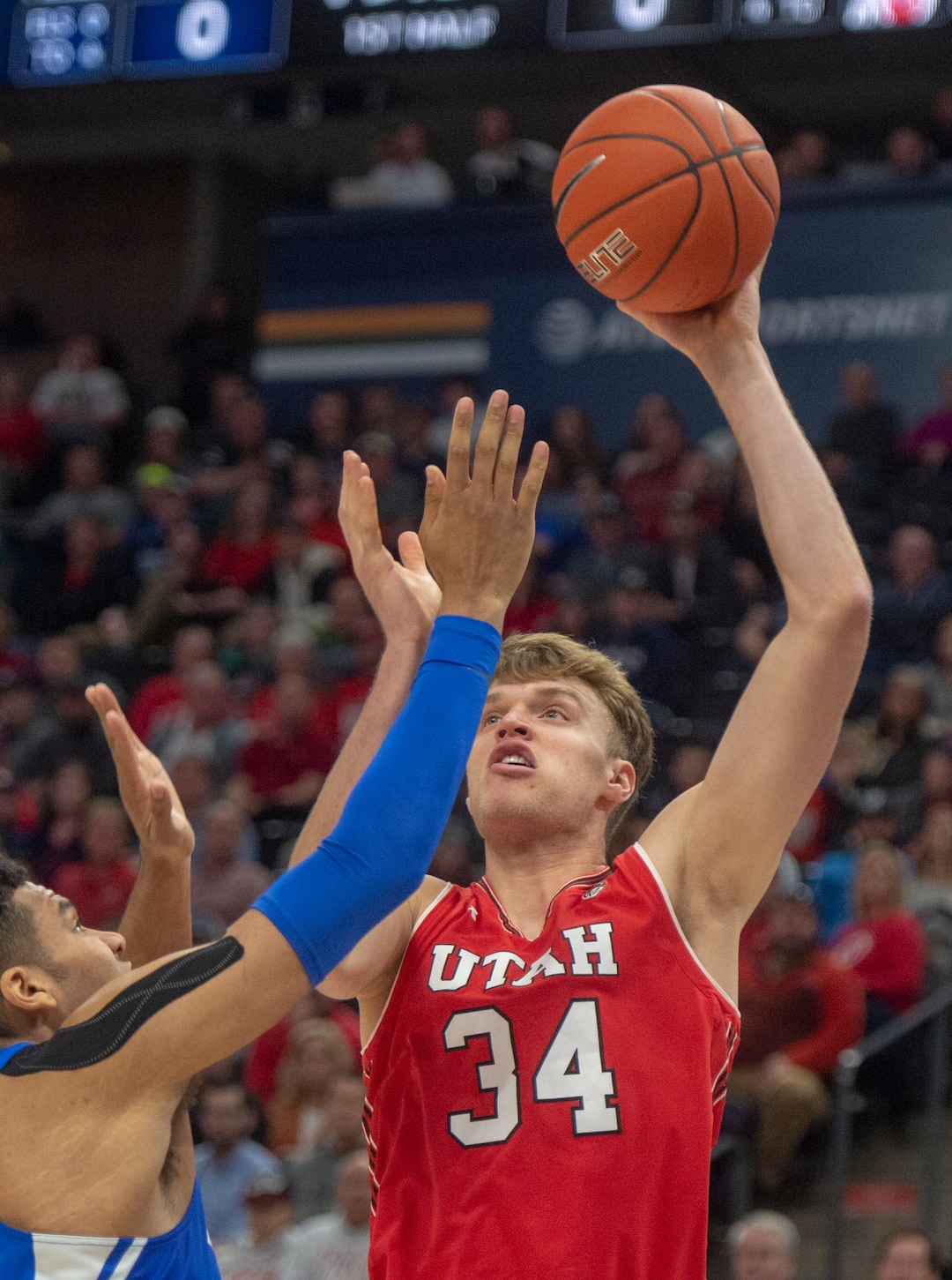 (Rick Egan  |  The Salt Lake Tribune)   Brigham Young forward Yoeli Childs (23) defends for the Cougars, as Utah Utes center Jayce Johnson (34) shoots, in basketball action in the Beehive Classic, between against the Brigham Young Cougars and Utah Utes, at the Vivint Smart Home Arena, Saturday December 8, 2018.
