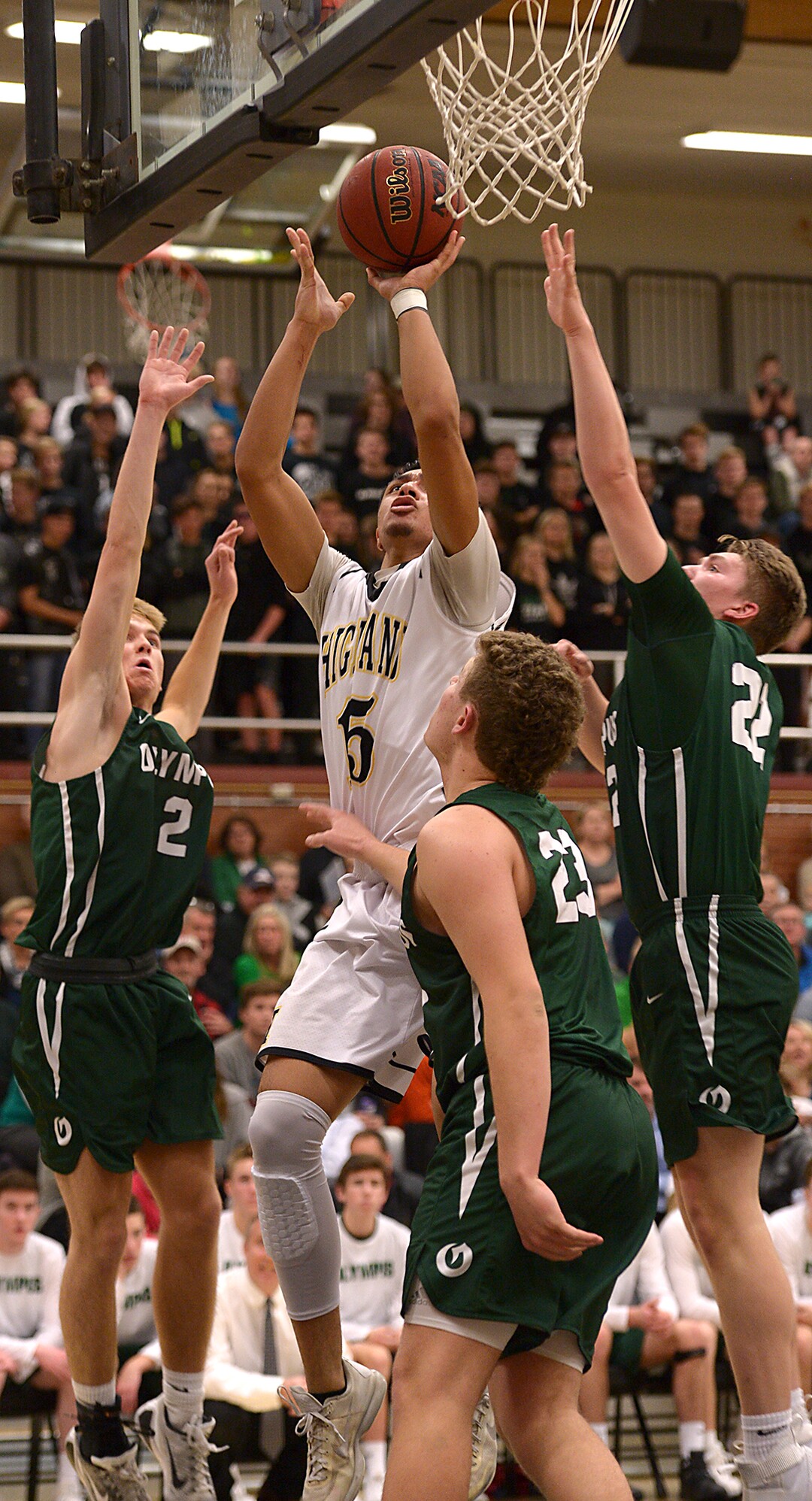 (Leah Hogsten  |  The Salt Lake Tribune) Highland's Jordan Tyner fires off the shot. Olympus High School defeated Highland High School 86-54 during their basketball game, Tuesday, February 6, 2018.