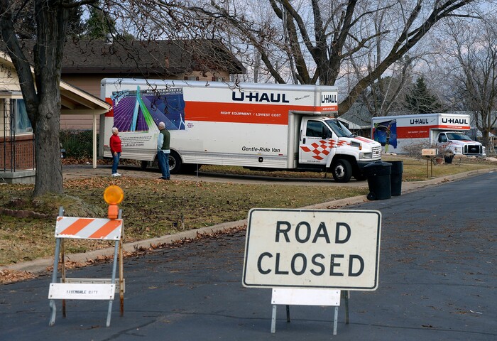 (Al Hartmann | The Salt Lake Tribune)
Four houses near the edge of a canyon slope near 4860S. 600 W. in Riverdale have been evacuated due to a landslide in their backyard. U Haul trucks in the front yards are ready to move household belongings.