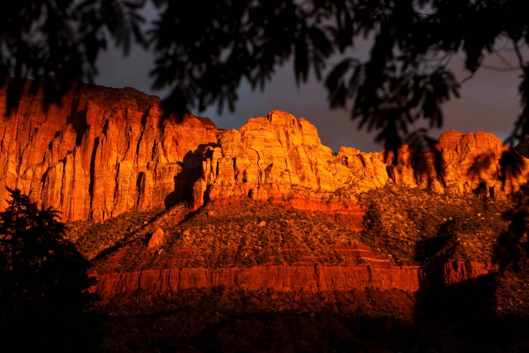Trent Nelson  |  The Salt Lake TribuneThe sun sets on peaks overlooking Springdale, Thursday, October 10, 2013. The state and federal governments are working out the details of a deal to reopen Zion and the other national parks in Utah as the government shutdown continues.