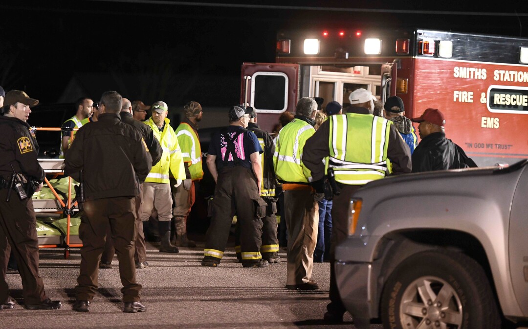 Emergency personnel work the staging area at Sanford Middle School in Beauregard, Ala., Sunday, March 3, 2019, after tornados ravaged the area, causing multiple fatalities. (AP Photo/Julie Bennett)