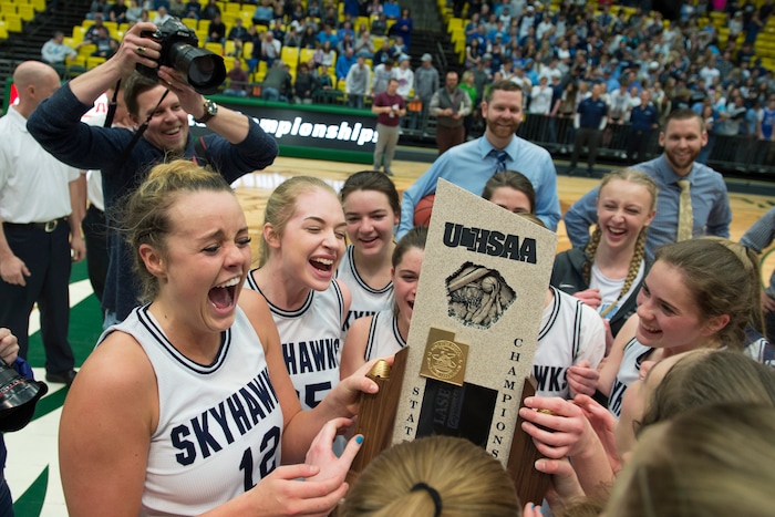 Scott Sommerdorf | The Salt Lake TribuneLauren Gustin, left, celebrates with team mates after winning the state title. Salem Hills beat Hurricane 57-35 for the 4A girl's title, Saturday, March 3, 2018.