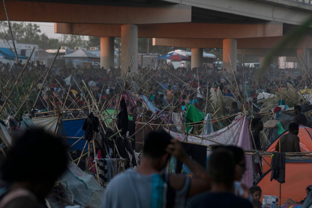 (Veronica G. Cardenas | The New York Times)

People seeking asylum at a makeshift camp near the Del Rio International Bridge as they wait to turn themselves in to Border Patrol agents in Del Rio, Texas on Friday, Sept. 17, 2021. The temporary camp in Del Rio has grown with staggering speed in recent days during a massive surge in migration that has overwhelmed the authorities.