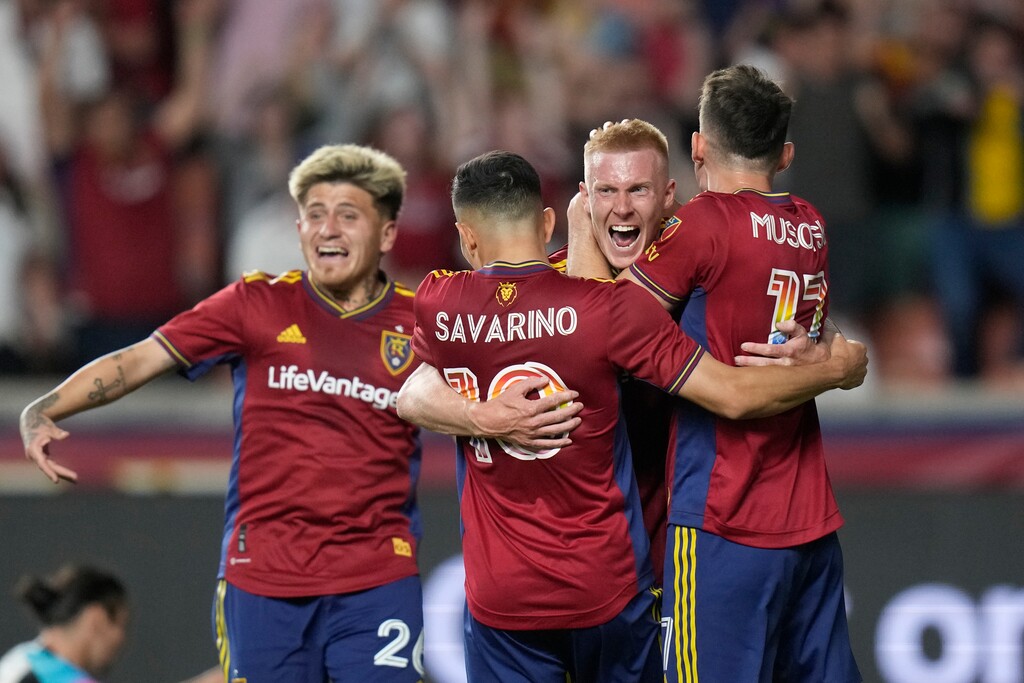 Real Salt Lake's Justen Glad, right rear, celebrates his goal against Minnesota United with Danny Musovski (17) and Jefferson Savarino (10) during the second half of an MLS soccer match Saturday, June 24, 2023, in Sandy, Utah. (AP Photo/Rick Bowmer)