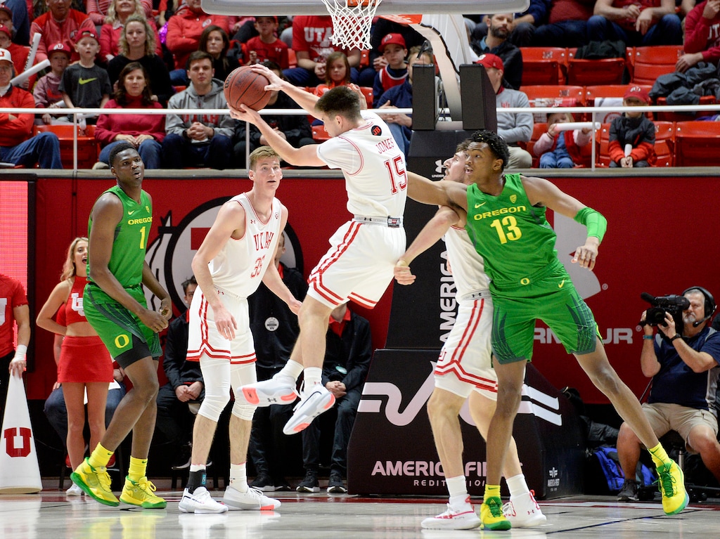 (Leah Hogsten  |  The Salt Lake Tribune) Utah Utes guard Rylan Jones (15) pulls down the rebound as the University of Utah basketball team hosts No. 4 Oregon, Jan. 4, 2020, at the Huntsman Center.