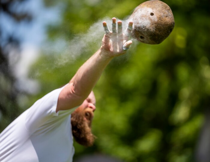 (Rick Egan | The Salt Lake Tribune) Wil Quinn Bumgarner from Tremonton competes in the open stone toss, in the Highland games, at the Payson Scottish Festival, on Saturday, July 9, 2022.
