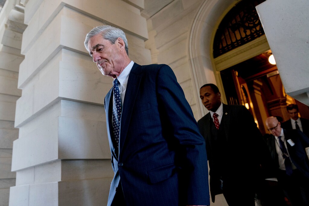 FILE - In this June 21, 2017, file photo, former FBI Director Robert Mueller, the special counsel probing Russian interference in the 2016 election, departs Capitol Hill following a closed door meeting in Washington. Prosecutors working for Mueller are recommending a short prison sentence for a former Trump campaign adviser who lied to the FBI during the Russia probe. Mueller’s team says in a new court filing that George Papadopoulos should spend at least some time incarcerated and pay a nearly $10,000 fine. His recommended sentence under federal guidelines is zero to six months, but prosecutors note a similar defendant in the case spent 30 days in jail.(AP Photo/Andrew Harnik, File)