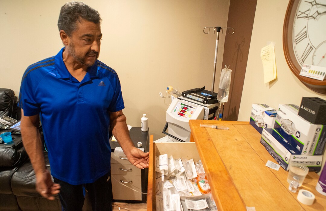 (Rick Egan  |  The Salt Lake Tribune)     Raul Gutierrez goes through the steps to setup his machine, as an in-home dialysis patient. Thursday, Sept. 5, 2019.
