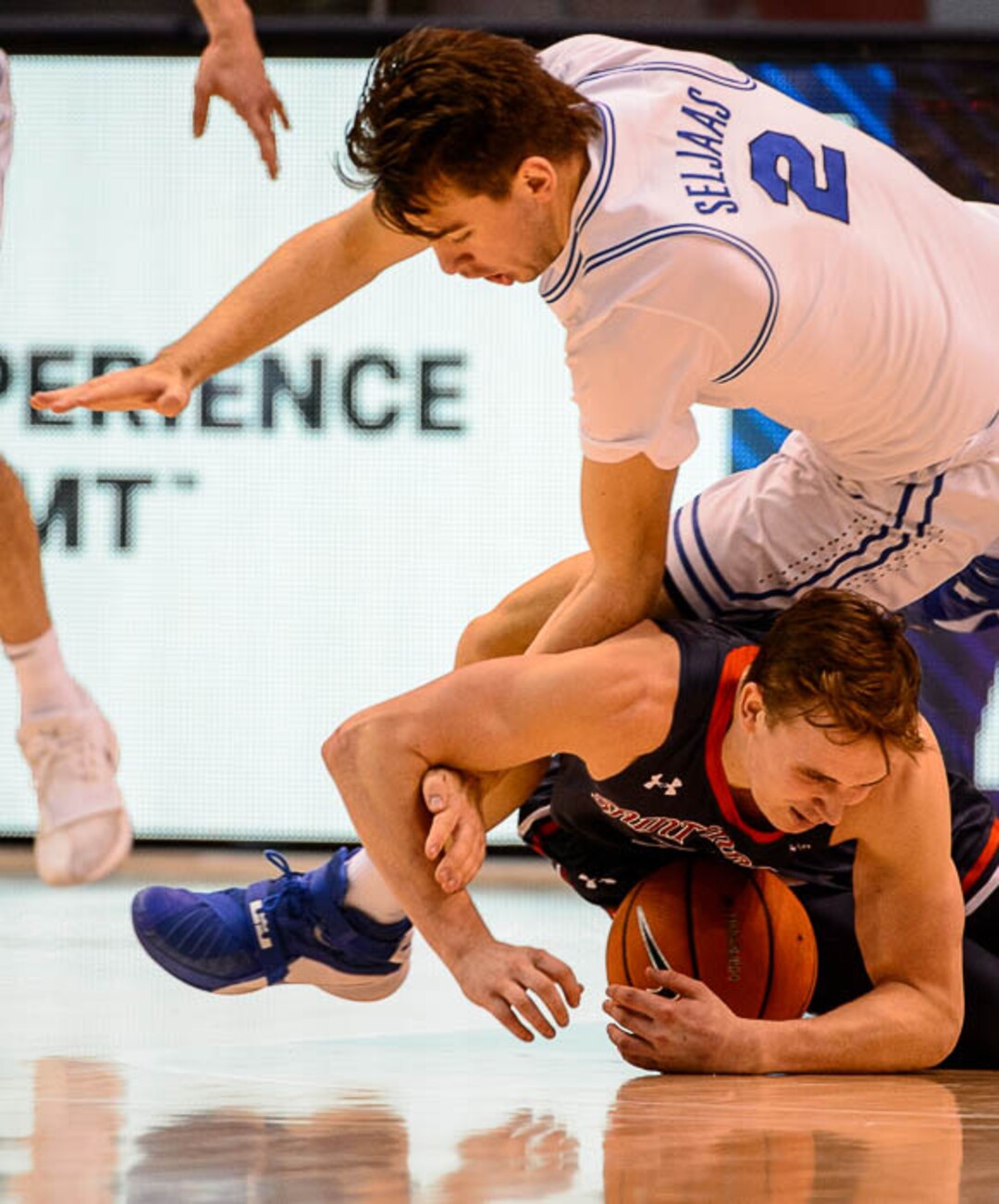 (Trent Nelson | The Salt Lake Tribune)   Brigham Young Cougars guard Zac Seljaas (2) falls on St. Mary's Gaels guard Emmett Naar (3) as BYU hosts the St. Mary's Gaels, NCAA basketball in Provo, Saturday December 30, 2017.