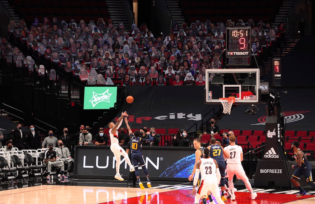 The Portland Trail Blazers and The Utah Jazz play in front of fan cardboard cutouts in the stand during the first half of an NBA basketball game in Portland, Ore., Wednesday, Dec. 23, 2020. (AP Photo/Steve Dipaola)