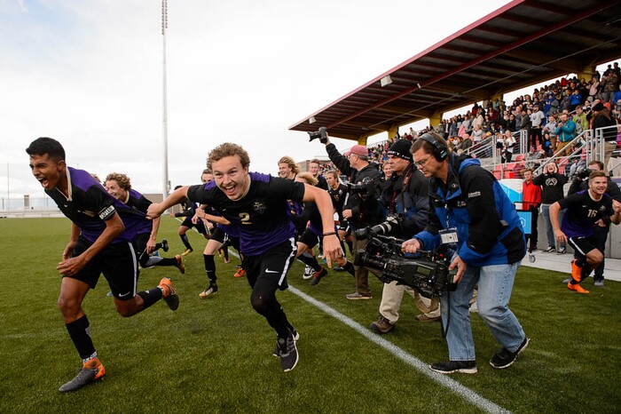 (Trent Nelson | The Salt Lake Tribune)  Desert Hills players celebrate their win over Park City High School in the 4A state championship game, Saturday May 12, 2018.