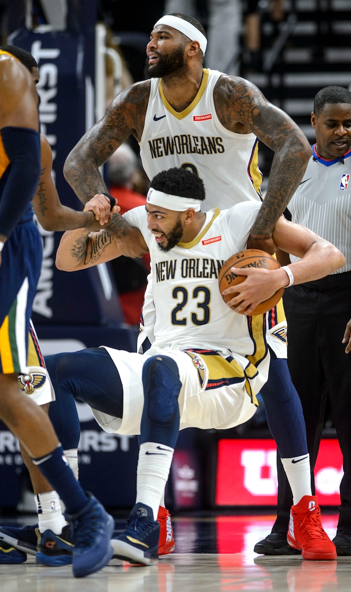 (Steve Griffin  |  The Salt Lake Tribune) New Orleans Pelicans center DeMarcus Cousins (0) lifts up t4eammate New Orleans Pelicans forward Anthony Davis (23) during the the Utah Jazz versus the New Orleans Pelicans NBA basketball game at the Vivint Smart Home Arena in Salt Lake City Wednesday January 3, 2018.