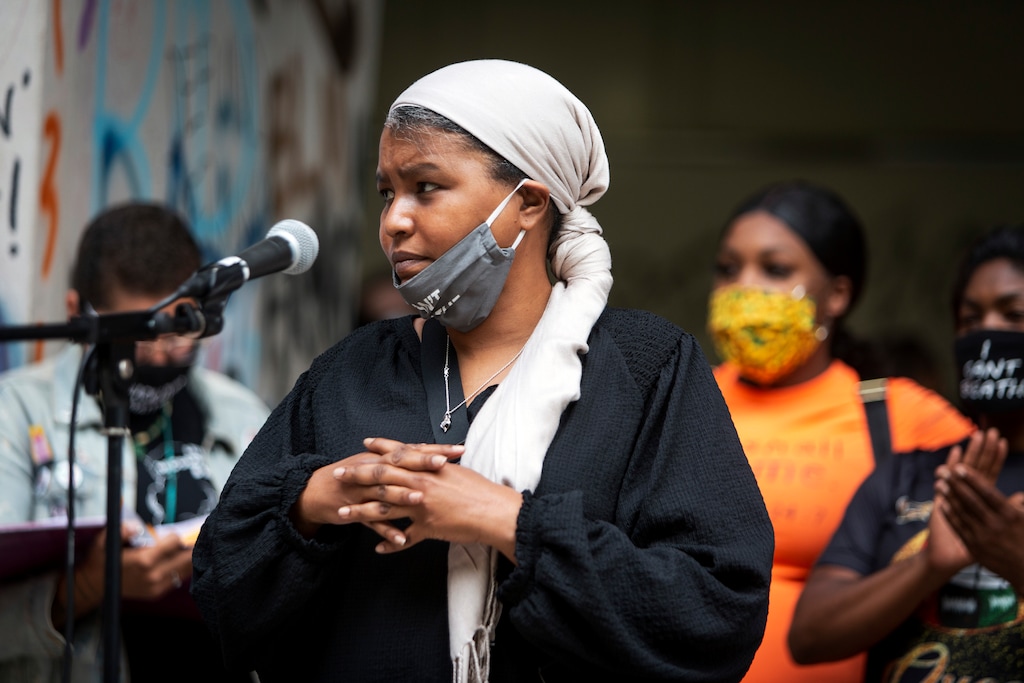 (Brooke Herbert | The Oregonian via AP) Teressa Raiford, executive director of Don't Shoot Portland, speaks in front of a crowd gathered in front of the Mark O. Hatfield Federal Courthouse in downtown Portland, Ore., on July 17, 2020, with several religious leaders calling for nonviolent protests and greater accountability from local and federal officials. Other speakers called for an end to racial injustice. Protests in Portland have topped the headlines for days, but lost in the shouting are the voices of Black residents themselves. Their feelings about the unrest are nuanced and diverse.